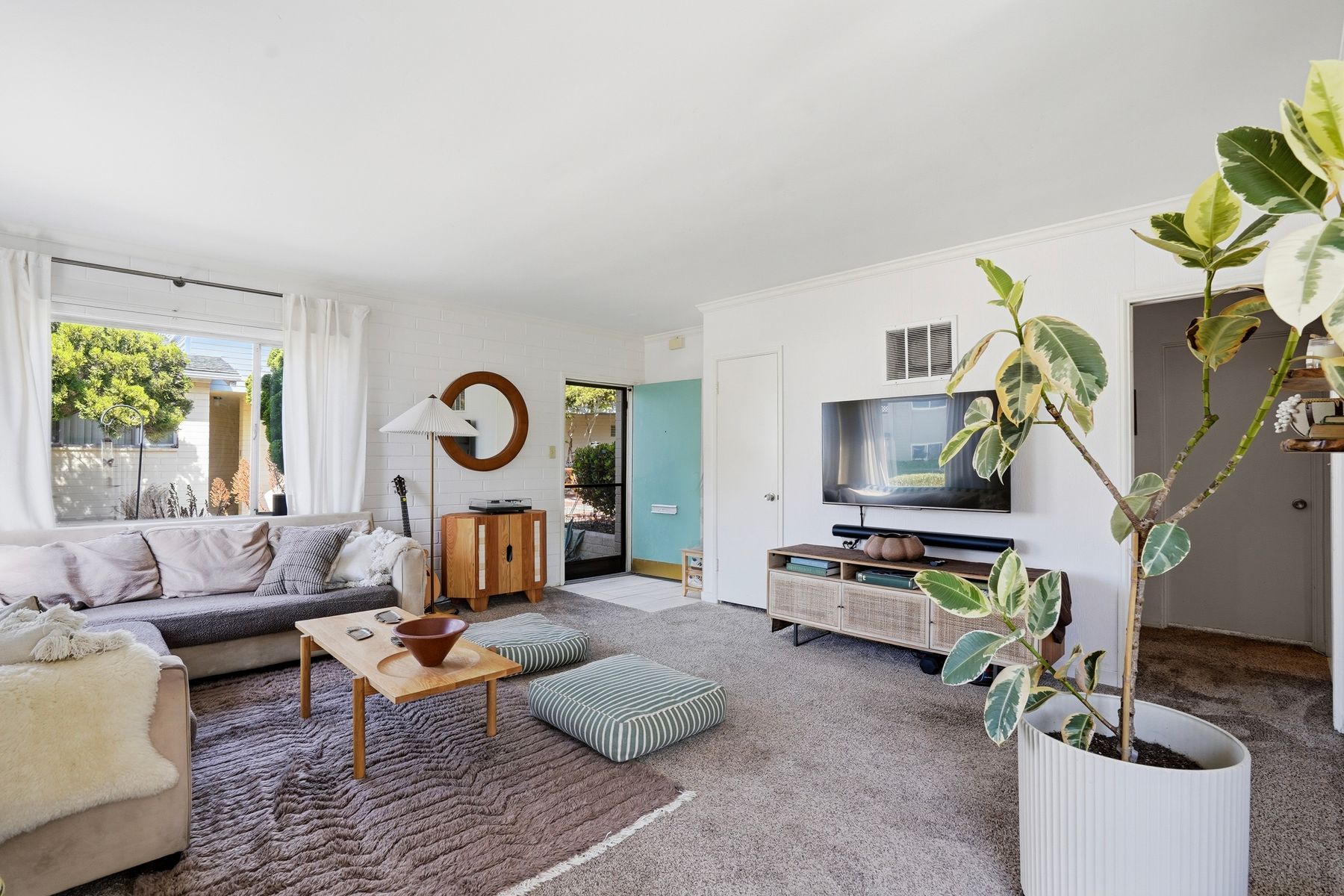 Living room of a Rosemont unit with natural light
